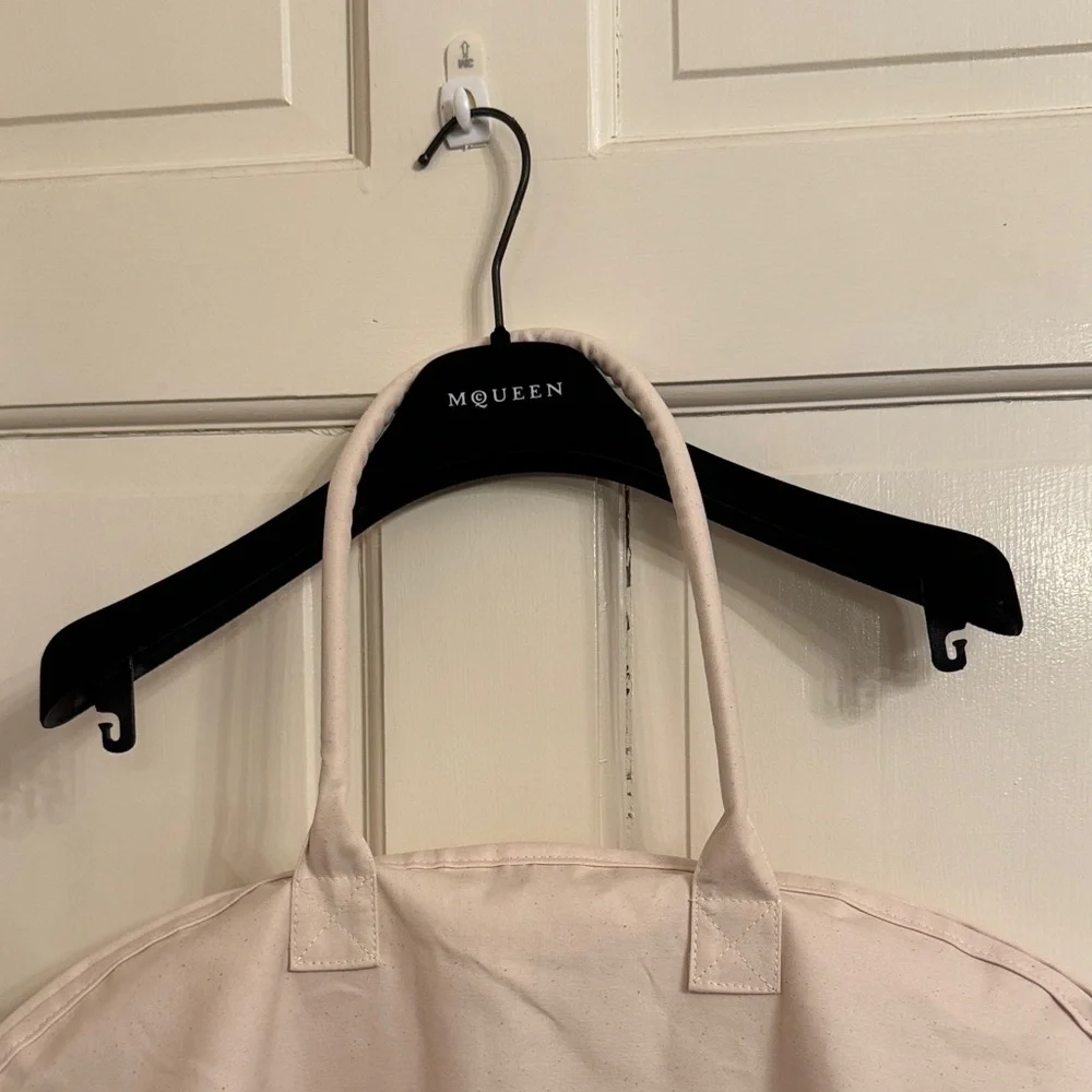 New McQueen Cream Garment Bag with hanger